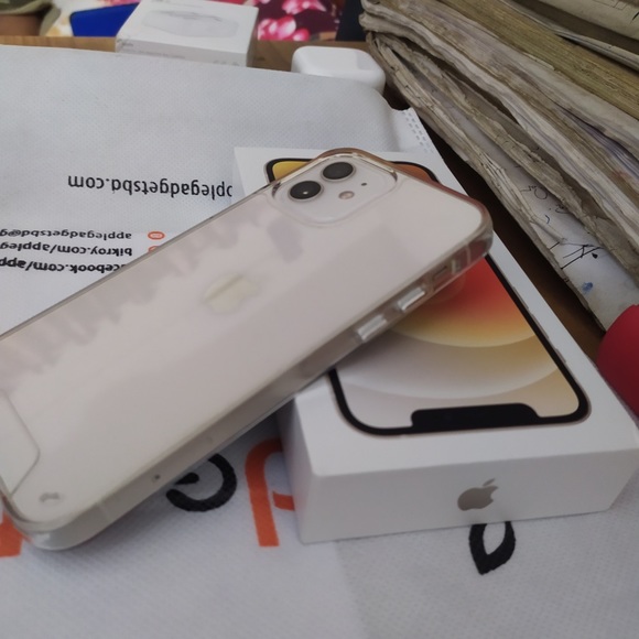 This is iPhone 12 which is 128gb and the colour is white.comes with box,charger. - Picture 3 of 5